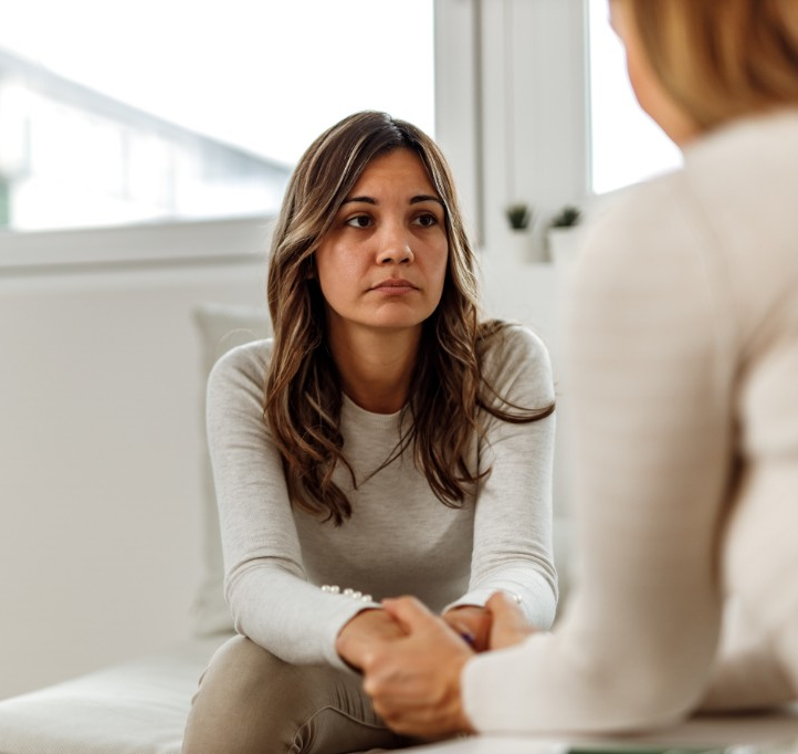 Woman receiving supportive care during a mental health consultation