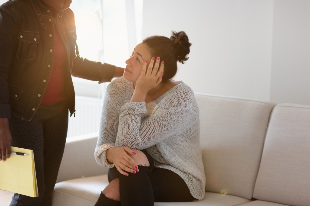 Nurse practitioner offering reassurance during a mental health consultation